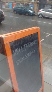 Well-designed democracy sign (in the rain)