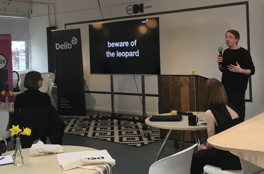Photo showing Ben from Delib in front of a slide that says "beware of the leopard"