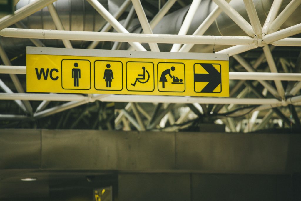 Image of an airport sign, using universally recognised symbols. An example of accessible design